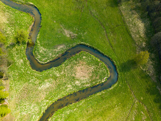 Meandering and twisting river. View from above. Ploucnice river Czech Republic