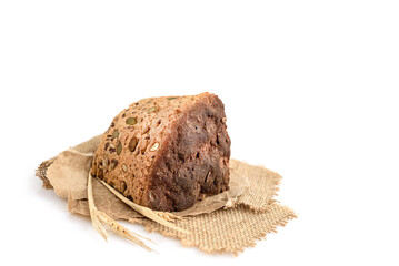 A slice of homemade grain bread on white
