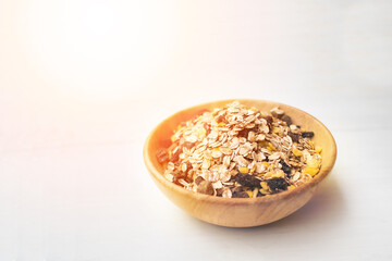sunrise muesli on a white wooden table. muesli top view