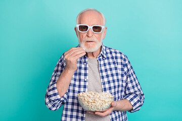 Photo of serious pensioner addicted to television eating popcorn wear checkered casual shirt...