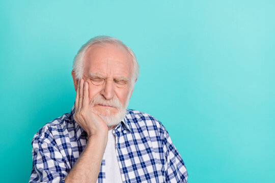 Portrait of negative mood grandpa holding cheek feel terrible tooth pain isolated on turquoise color background