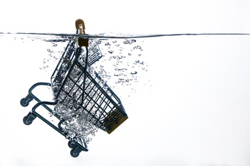 an empty supermarket trolley fell into the water