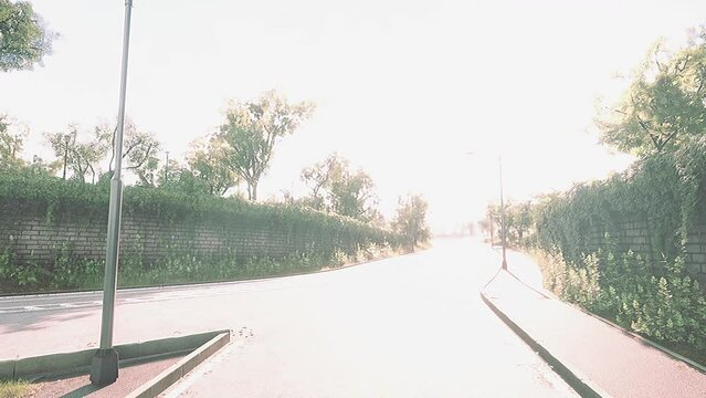 View of empty road with lamp post and sunlight