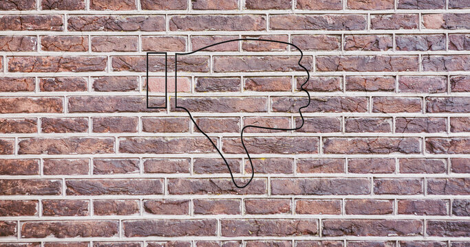 Image of glowing neon thumb down icon on brick wall - Powered by Adobe