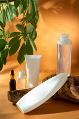 set of clean white bottle of shampoo, shower gel, body cream, face oil and tonic