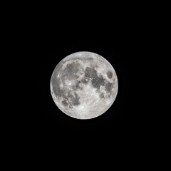 Detailed image of the full moon isolated on black.