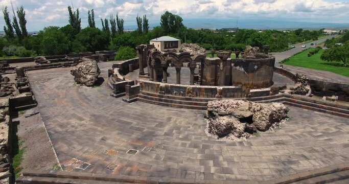 Ancient columns of Zvartnots (celestial angels) temple, Armenia. Central Asia, Unesco heritage site. Drone fly from Ruins of Zvartnots. Near Etchmiadzin City, Armavir Province, Armenia, Middle East.