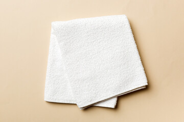 Top view of white towels with copy space on colored background