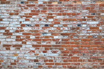 Old brick cracked wall background texture.