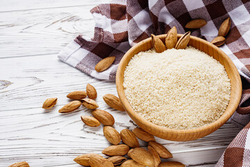almond flour on a white wooden rustic background