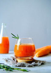 Carrot juice in a glassy glass. Freshly lived carrot juice. Orange carrot juice. Vegetable juice