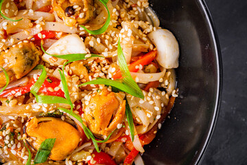 delicious chinese fried noodles on a black background