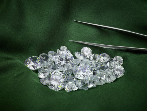Loose Diamond Parcel on Green Silk Background. Luxury Diamond Photograph. Ethical Eco-Friendly Green Diamonds. 