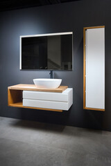 Stoneware countertop bathroom with tired beton wall stoneware tiled floor. Gray industrial flat...