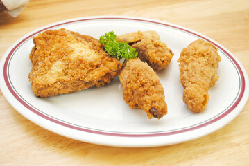 Fried Chicken Pieces Served on a White Plate