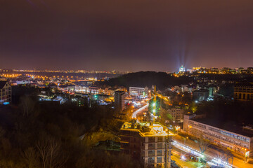 Fototapeta na wymiar Ukraine, Kyiv – November 26, 2016: Aerial panoramic view on central and historical part of Kyiv city, residential area in the evening. St Andrew's Church, Podil area.