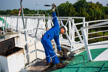 One male industrial engineers inspection level fuel oil tank