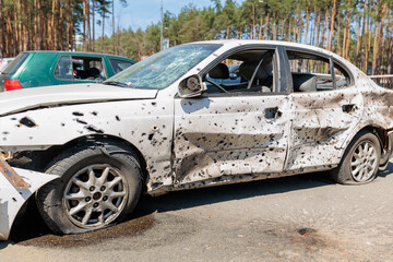 Many shot and destroyed cars at the car graveyard in Irpin, Ukraine.