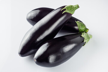 fresh natural eggplant on a white acrylic background