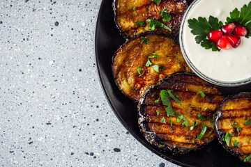grilled eggplant on Georgian on a gray stone background