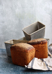 Traditional Ukrainian rye bread - Darnitskiy bread. Sourdough bread close up photo. Freshly baked homemade bread on a table. 