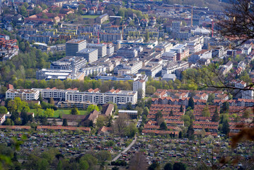 Panoramic view from local mountain Uetliberg over City of Zürich on a blue cloudy spring day. Photo taken April 14th, 2022, Zurich, Switzerland.