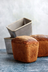 Traditional Ukrainian rye bread - Darnitskiy bread. Sourdough bread close up photo. Freshly baked homemade bread on a table. 