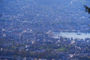 Panoramic view over City of Zurich with lake Zurich seen from local mountain Uetliberg on a summer day morning. Photo taken April 14th, 2022, Zurich, Switzerland.