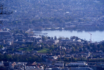 Panoramic view over City of Zurich with lake Zurich seen from local mountain Uetliberg on a summer day morning. Photo taken April 14th, 2022, Zurich, Switzerland.