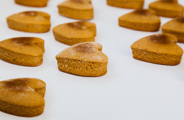 Heart shaped homemade cookies on a white background.