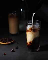 Cold coffee with ice in low key