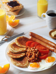 Traditional British breakfast with sausages and beans	