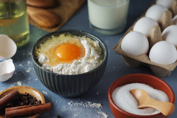 Food ingredients for baking: flour, eggs, milk, sugar