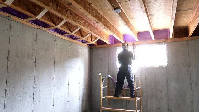 Sprayfoam insulation in an unfinished basement of a residential area.