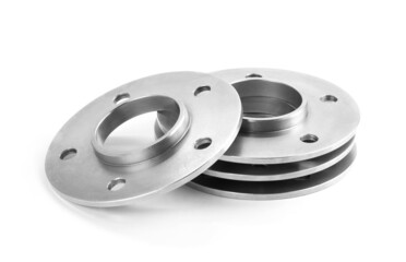 Aluminum wheel spacers. Four through spacers. Isolated on a white background