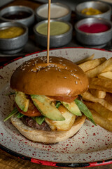 full burger and fries ready to eat