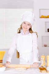 Portrait of cute girl baking in the kitchen