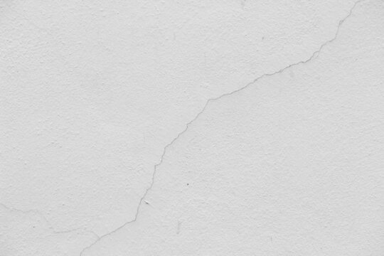 White concreat wall with cracks line abstract wallpaper background can be use for website template  construction company decorative and brochure template.