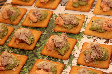 Traditional spanish tapas with tomatoes, mozzarella cheese, avocado and mushrooms. chips tortillas snacks