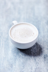 Coffee with milk on wooden background. Soft focus. Close up. Copy space.