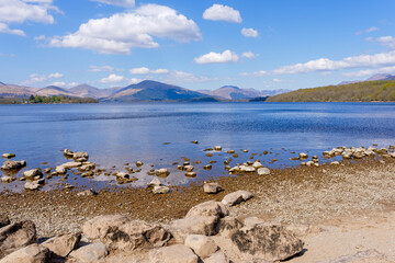 Sandstone rocks and pebbles on the shores of Loch Lomond.