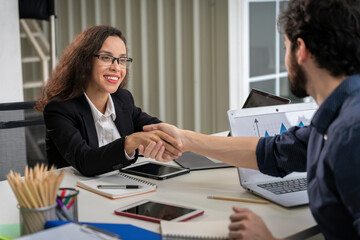 two business women  wearing glasses wearing earrings shaking hands with business men make an agreement concept finance marketing agreement consent acceptance Break The Science Bias