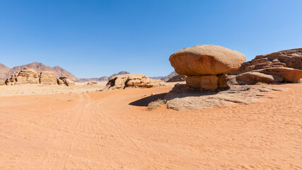 Fototapeta na wymiar Mushroom shaped rock formation in Wadi Rum desert, a popular safari and trekking touristic destination in Jordan, Middle East
