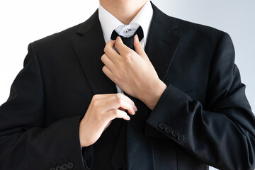 Put on a tie for formal wear
