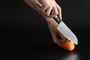 Cut carrot with knife