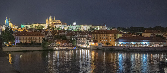 Fototapeta na wymiar Night view of Prague Castle complex, largest in the world, Czech national symbol for more than thousand years, from Charles Bridge (Karluv Most), Prague, Czech Republic 