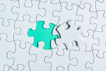 Piece of jigsaw puzzle. Flat lay, Directly above. Copy space.
