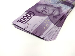 10000 rupiah papers, Indonesia's official currency, isolated on white background