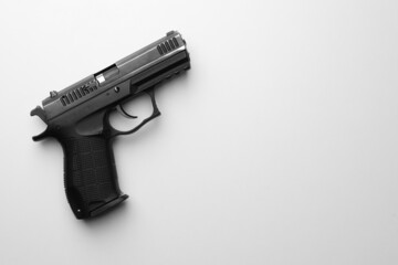 Semi-automatic pistol on white background, top view. Space for text - obrazy, fototapety, plakaty