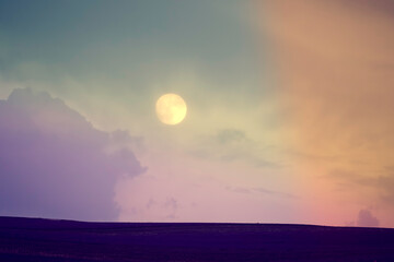 Fantastic fairytale landscape with the moon over a lavender field